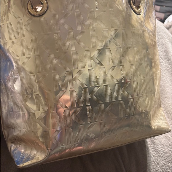 Michael Kors Women's Gold Metallic XL Tote Bag .
16” W x 11” T x 6.5” D - Picture 10 of 16
